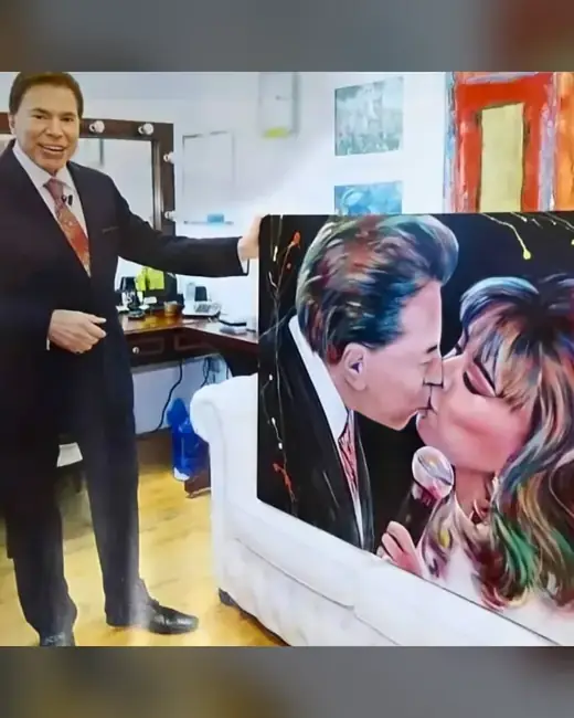Silvio Santos com o retrato pintado por Ale Baggio