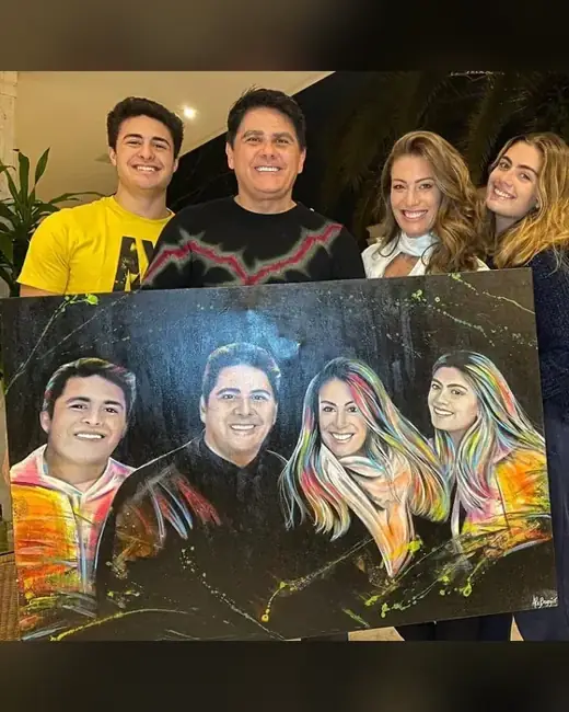 Cesar Filho e Elaine Mickely com o retrato pintado por Ale Baggio